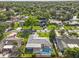 Neighborhood aerial view showcasing the community, mature trees, and nearby homes at 155 Patty Ann Blvd, Palm Harbor, FL 34683