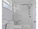 Bathroom featuring a tiled shower with a glass door and multiple shelves at 155 Patty Ann Blvd, Palm Harbor, FL 34683