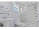 Clean bathroom with a stand-up shower, pedestal sink, modern fixtures, and good natural light at 155 Patty Ann Blvd, Palm Harbor, FL 34683