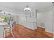 Bright dining room with a beverage bar featuring a white cabinet with glass doors at 155 Patty Ann Blvd, Palm Harbor, FL 34683