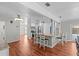 Open kitchen layout featuring a breakfast bar with seating and white cabinets at 155 Patty Ann Blvd, Palm Harbor, FL 34683