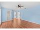 Spacious main bedroom with a ceiling fan, walk-in closet, and attached bath at 155 Patty Ann Blvd, Palm Harbor, FL 34683