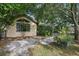 Backyard with mature trees and lush greenery, offering a secluded and peaceful outdoor space at 1641 Bayfield Ct, Trinity, FL 34655