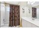 Bathroom featuring white vanity and tub-shower combo at 1641 Bayfield Ct, Trinity, FL 34655