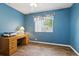 Comfortable room with blue walls, and a ceiling fan at 1641 Bayfield Ct, Trinity, FL 34655