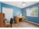 Comfortable room with blue walls, and a ceiling fan at 1641 Bayfield Ct, Trinity, FL 34655