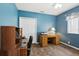 Comfortable room with blue walls, and a ceiling fan at 1641 Bayfield Ct, Trinity, FL 34655