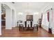 Elegant dining room with modern chandelier, seating for six, and ample natural light at 1641 Bayfield Ct, Trinity, FL 34655