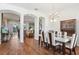 Elegant dining room features a modern table set, chandelier, and seamless flow to other living spaces at 1641 Bayfield Ct, Trinity, FL 34655