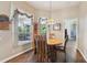 Cozy breakfast nook with natural light, charming curtains, and views of the screened outdoor space at 1641 Bayfield Ct, Trinity, FL 34655
