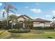 Charming single-story home with well-manicured landscaping, mature palms, and inviting curb appeal at 1641 Bayfield Ct, Trinity, FL 34655
