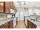 Well-appointed kitchen featuring granite countertops, stainless steel appliances, and open layout to the other living spaces at 1641 Bayfield Ct, Trinity, FL 34655