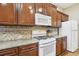 Gourmet kitchen featuring granite countertops, stainless steel appliances, and ample cabinet space at 1641 Bayfield Ct, Trinity, FL 34655