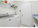 Bright laundry room features modern washer and dryer units at 1641 Bayfield Ct, Trinity, FL 34655