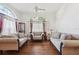 Bright living room with soaring ceilings, elegant sofas, hardwood floors, and large windows at 1641 Bayfield Ct, Trinity, FL 34655