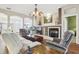 Spacious living room with fireplace, hardwood floors and ample natural light throughout the room at 1641 Bayfield Ct, Trinity, FL 34655