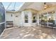 Covered patio with wood tile flooring, ceiling fan, and plenty of room for an outdoor dining set at 1641 Bayfield Ct, Trinity, FL 34655