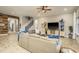 Spacious living room with wood-look tile flooring, fireplace, and plenty of natural light at 1771 Whitewillow Dr, Wesley Chapel, FL 33543