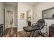 Multi-purpose room with dark hardwood floors, mirror, and bathroom access at 1771 Whitewillow Dr, Wesley Chapel, FL 33543