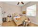 Cozy bedroom with natural light, a comfortable bed, and warm, inviting decor at 18328 Treehaven Dr, Hudson, FL 34667