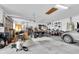 Large garage with high ceilings and plenty of space for storage and projects at 18328 Treehaven Dr, Hudson, FL 34667