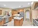 Bright kitchen featuring stainless steel appliances, a center island, and ample cabinet space at 18328 Treehaven Dr, Hudson, FL 34667