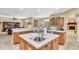 A kitchen featuring an island sink with an open concept design and lots of natural light at 18328 Treehaven Dr, Hudson, FL 34667