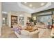 Open living room featuring tile floors and a view of the kitchen and outdoor living space at 18328 Treehaven Dr, Hudson, FL 34667