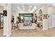 Spacious living room featuring tile floors, a fireplace, and sliding glass doors to the backyard at 18328 Treehaven Dr, Hudson, FL 34667