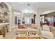 Comfortable living room with an arched doorway and a view of the front door at 18328 Treehaven Dr, Hudson, FL 34667