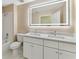 Bathroom featuring a double sink, white cabinets, quartz countertop, and a tiled shower and tub at 18456 Merseyside Loop, Land O Lakes, FL 34638