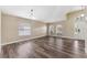 Open-concept living space featuring abundant natural light and sleek flooring at 18456 Merseyside Loop, Land O Lakes, FL 34638