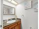 Bathroom sink with granite countertop, mirror and decor at 2410 Hammock Pine Blvd # 2410, Clearwater, FL 33761