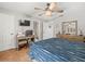 Bedroom with desk, TV, tile floors, ceiling fan, access to bathroom at 2410 Hammock Pine Blvd # 2410, Clearwater, FL 33761