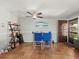 Cozy dining room featuring tile floors, ceiling fan and an adjacent door to the balcony at 2410 Hammock Pine Blvd # 2410, Clearwater, FL 33761