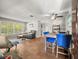 Open floor plan showing living room, dining area with tile flooring, lots of natural light and comfortable seating at 2410 Hammock Pine Blvd # 2410, Clearwater, FL 33761
