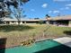 A serene backyard surrounded by neighboring homes at 24862 Us Highway 19 N # 203, Clearwater, FL 33763