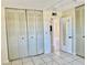 Bedroom featuring tile floors, closets, and a view to another room at 24862 Us Highway 19 N # 203, Clearwater, FL 33763