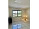 Bedroom with natural light, dresser, and backyard view at 24862 Us Highway 19 N # 203, Clearwater, FL 33763