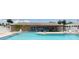 Relaxing community pool area with lounge chairs and seating, ideal for enjoying the outdoors at 24862 Us Highway 19 N # 203, Clearwater, FL 33763