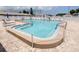 Community pool surrounded by lounge chairs; inviting spot for relaxation and socializing at 24862 Us Highway 19 N # 203, Clearwater, FL 33763