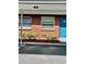 Clean brick exterior with lush landscaping and well maintained community at 24862 Us Highway 19 N # 203, Clearwater, FL 33763