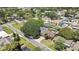 An aerial view showcasing the community, homes, mature trees and streets of the neighborhood at 279 Maple Ave, Palm Harbor, FL 34684