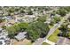 An aerial view showcasing the community, homes, mature trees and streets of the neighborhood at 279 Maple Ave, Palm Harbor, FL 34684