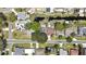 Overhead shot displays a home with a pool, waterfront access, and well-kept landscaping in a suburban neighborhood at 279 Maple Ave, Palm Harbor, FL 34684