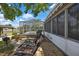 Outdoor patio area with lounge chairs, barbeque and lush landscaping, ideal for relaxing or entertaining at 279 Maple Ave, Palm Harbor, FL 34684