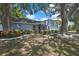 Well-maintained home boasts lovely landscaping and mature trees, providing shade and beauty at 279 Maple Ave, Palm Harbor, FL 34684
