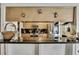 Modern kitchen features sleek countertops, stainless steel appliances, and ample cabinet space at 279 Maple Ave, Palm Harbor, FL 34684