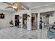 Large living room with tile flooring and view to other living spaces at 279 Maple Ave, Palm Harbor, FL 34684