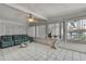 Sunroom with tile flooring, sofa, and plenty of natural light at 279 Maple Ave, Palm Harbor, FL 34684